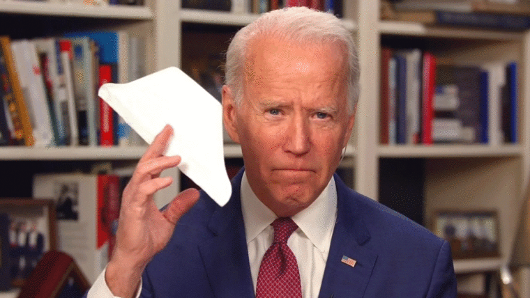 Biden shows off face mask at home